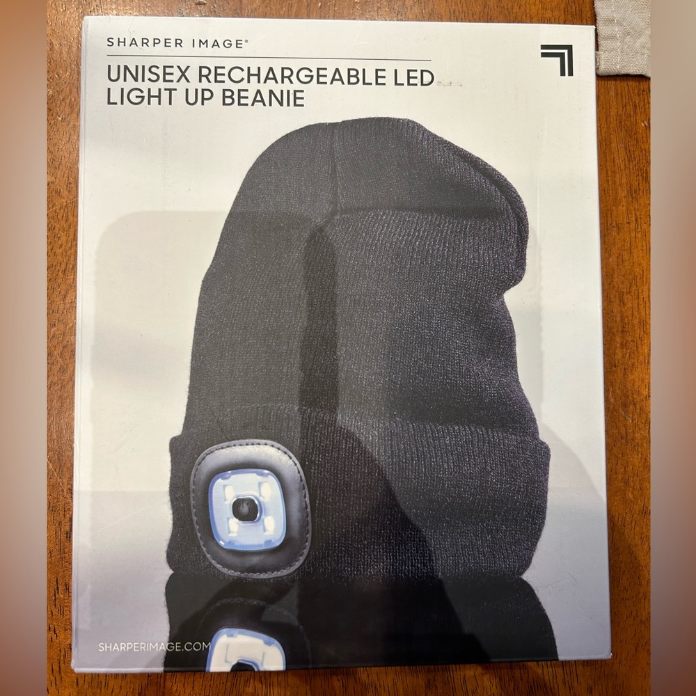 NEW Sharper Image UNISEX RECHARGEABLE LED
LIGHT UP BEANIE